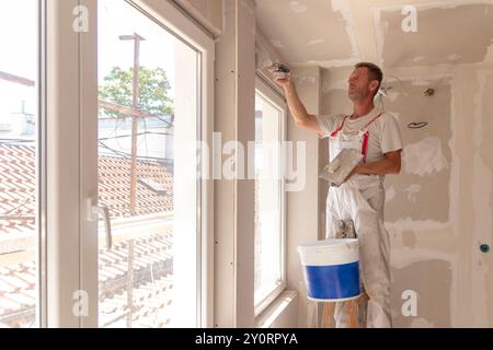 Apartment renovation. Home renovation workers crew. Builders apartment improvement or restoration works. Stock Photo