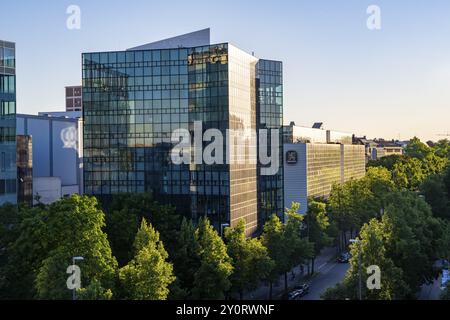 Modern office building, Loewenbraeu brewery building in the evening light, Stiglmaierplatz, Munich, Upper Bavaria, Bavaria, Germany, Europe Stock Photo