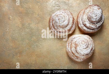 Bakery product, lemon twist, with white glaze, sweet bun, muffin, pastries, top view, no people Stock Photo
