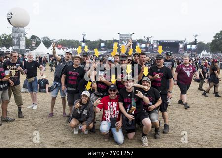 Festival visitors from Ravensburg on Lake Constance with arrows on their heads at the Wacken Open Air in Wacken. The traditional metal festival takes Stock Photo