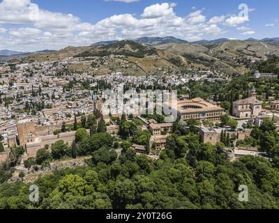 View of a city with historic buildings and lush vegetation in a hilly landscape, aerial view, Alhambra, Andalusia, Granada, Spain, Europe Stock Photo