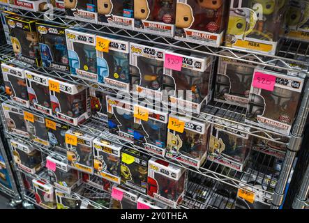 A shelf filled with Funko pop figures from the Star Wars franchise. Stock Photo