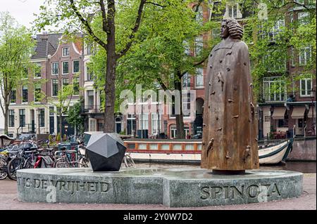 AMSTERDAM, NETHERLANDS - MAY 08, 2012:  Bronze statue of Dutch philosopher Baruch de Spinoza by Nicolas Dings in Zwanenburgwal Stock Photo