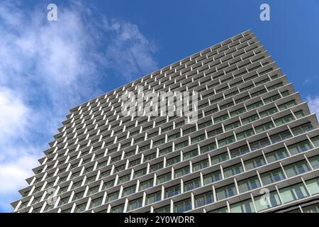 Modern office building facade with repeating geometric pattern in Tokyo Stock Photo
