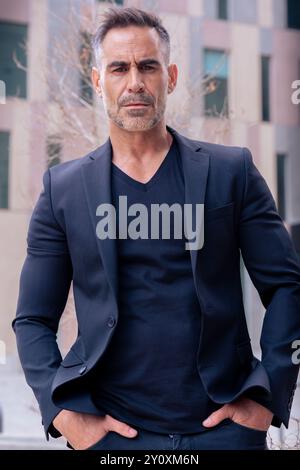 portrait of serious businessman looking at camera outdoors.Vertical Stock Photo