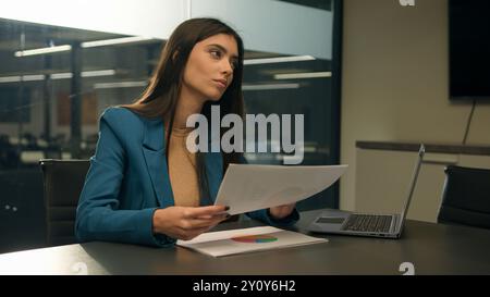 Arabian girl Indian business woman Caucasian businesswoman designer female girl at office think pondering decision creative looking at design sketches Stock Photo