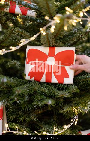 Decorates Christmas tree with big red bows Stock Photo