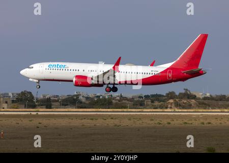 Enter Air Boeing 737-8 MAX (REG: SP-EXH) still carrying part of its former livery from SpiceJet. Stock Photo