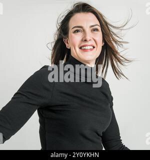 Portrait in studio of happy woman Stock Photo