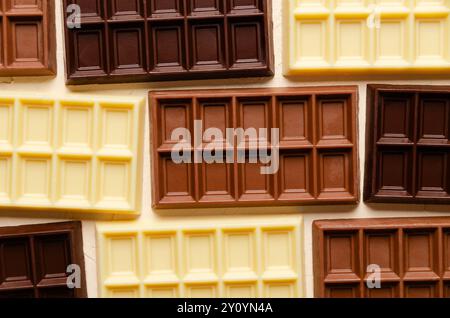 Background of dark, milk and white chocolate bars. Top view. Stock Photo