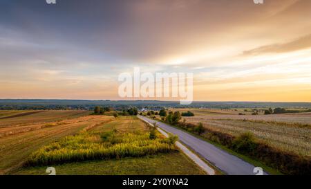 Beautiful landscape. Colorful sky, road and fields. Forests in the distance. View from the observation tower.  Susiec, Roztocze, Poland Stock Photo