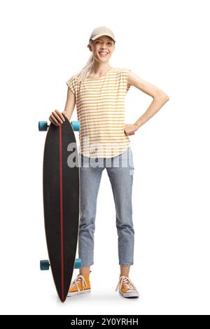 Young female posing with a longboard isolated on white background Stock Photo