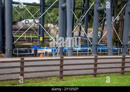 Canal narrowboat in the Anderton boat lift, connecting the Trent and Mersey canal with the river Weaver at Anderton near Northwich Cheshire Stock Photo