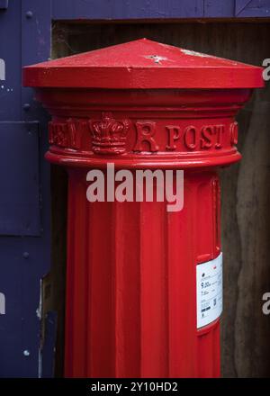 Closeup of Victorian red Royal Mail pillar box post box on High Street Eton Berkshire England UK Stock Photo