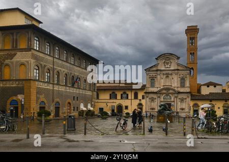 The church of Ognissanti overlooking the Lungarno Amerigo Vespucci river bank during a spring storm, Florence, Tuscany, Italy Stock Photo