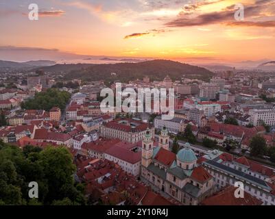 Aerial view of central Ljubljana Slovenia with historic buildings, hilltop castle red roof houses, churches in the Slovenian capital sunset colorful s Stock Photo