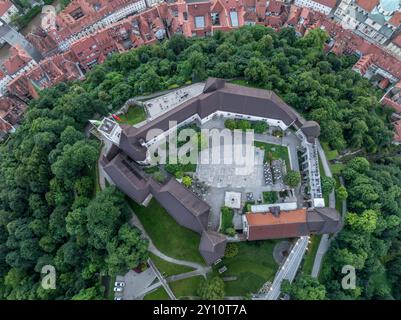 Aerial top down view of Ljubljana castle with towers, courtyard, ramparts on the hilltop above the Slovenian capital Stock Photo