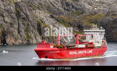 Prince Christian Sound, Greenland - 28 August 2024: Cargo supply ship Malik Arctica sailing on a fjord in Prince Christian Sound in Greenland Stock Photo