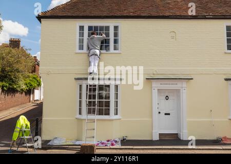 England, Kent, Sandwich, House Painter and Decorator at Work Stock Photo