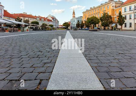 Cobblestone paved Town Hall Square in Vilnius Old Town. Historic, trend destination , cityscape, tourism. Lithuania. Place for text Stock Photo