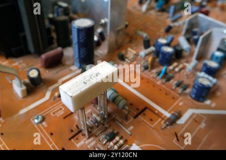 High power ceramic resistor on an electronic board. 6 Watt 39 Ohm resistance. Focused on ceramic resistor. Stock Photo