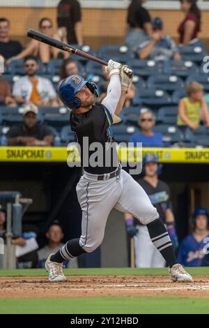 Durham, NC: Durham Bulls outfielder Jake Magnum (12) flies out to left field during an MiLB game against the Buffalo Bisons on August 29, 2024 at Durh Stock Photo