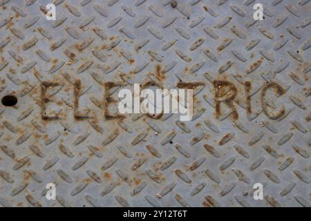 electric metal plate covering on ground Stock Photo