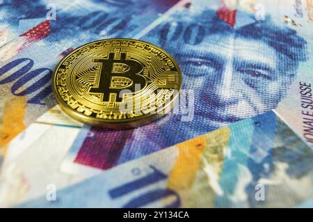 Photo of Crypto currency concept, A Bitcoin with Swiss franc currency, Switzerland, Europe Stock Photo