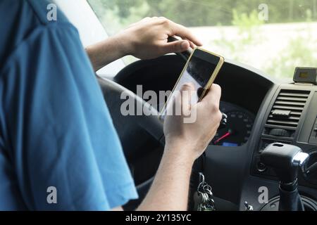 Photo of a man using smartphone while driving the car, transportation and vehicle concept with icon social media send email wifi chat read email Stock Photo