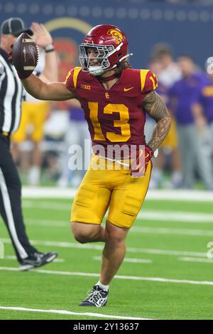 USC Trojans linebacker Mason Cobb (13) celebrates after intercepting a pass in the closing seconds during an NCAA football game against the LSU Tigers Stock Photo