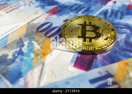 Photo of Crypto currency concept, A Bitcoin with Swiss franc currency, Switzerland, Europe Stock Photo