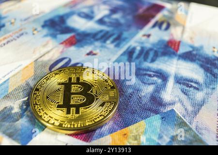 Photo of Crypto currency concept, A Bitcoin with Swiss franc currency, Switzerland, Europe Stock Photo