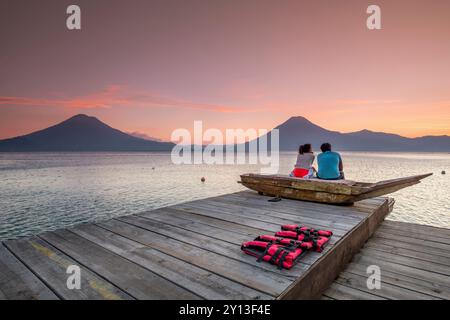 Tourists on a mooring enjoying the sunset, Lake Atitlan and San Pedro