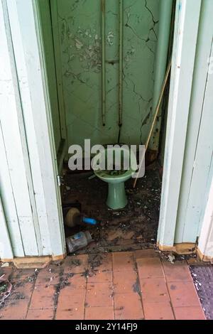 Old dirty toilet in an abandoned house Stock Photo