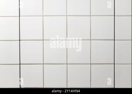 White square tiles on bathroom wall as texture or background Stock Photo