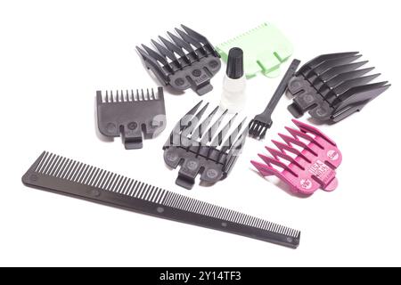 Hair cutting kit: oil, comb,nozzles of different sizes for a hair clipper. Stock Photo