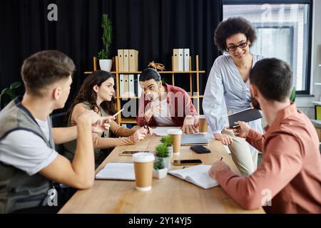 Stylish colleagues engage in important discussions during a challenging time. Stock Photo