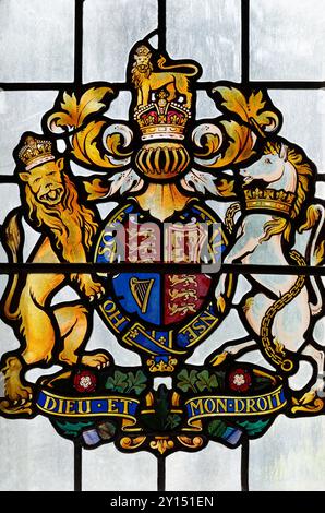 The Royal Coat of Arms on a stained glass window in St Michael's Church, Shap, Westmorland & Furness, Cumbria, UK Stock Photo