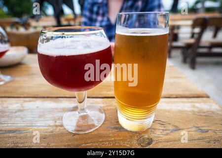 Close up of glasses of beer on wooden table background. Stock Photo