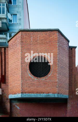 Round circle window on old and weathered brick wall - concept image with copy space. Stock Photo