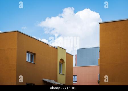 Several windows on the wall of a building with a yellow facade. Stock Photo