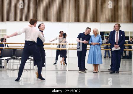 Aaron S. Watkin, Artistic Director, Queen Camilla, Patron of English National Ballet and Sir Rupert Gavin (right), Chair, English National Ballet, watch rehearsals at the English National Ballet's Mulryan Centre for Dance in east London. This is the Queen's first official visit to the English National Ballet since being made its patron earlier this year. Picture date: Thursday September 5, 2024. Stock Photo