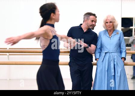 Aaron S. Watkin, Artistic Director and Queen Camilla, Patron of English National Ballet watch rehearsals at the English National Ballet's Mulryan Centre for Dance in east London. This is the Queen's first official visit to the English National Ballet since being made its patron earlier this year. Picture date: Thursday September 5, 2024. Stock Photo