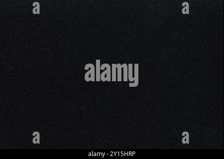 Black matte sparkle polystyrene texture background close up view Stock Photo