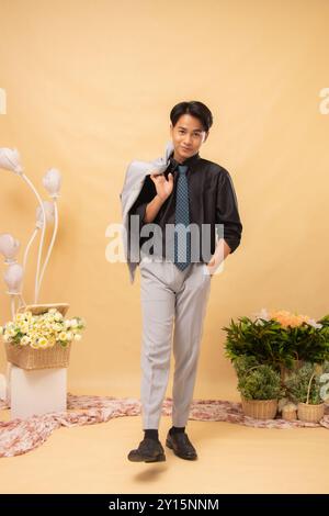 elegant man pose standing street formal relaxed smiling wide eyed front indoor photo shot. couple wedding national bride studio Stock Photo