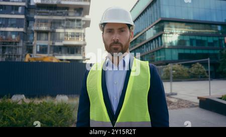 Serious architect build inspector property developer city urban building construction industry Caucasian middle-aged man worker in hardhat male Stock Photo