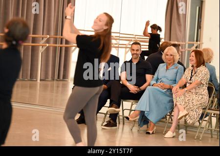 Aaron S. Watkin, Artistic Director and Queen Camilla, Patron of English National Ballet watch rehearsals at the English National Ballet's Mulryan Centre for Dance in east London. This is the Queen's first official visit to the English National Ballet since being made its patron earlier this year. Picture date: Thursday September 5, 2024. Stock Photo