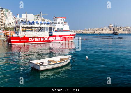 Valletta, Malta - August 23, 2019: Passenger ferry by Captain Morgan Cruises company is moored in Sliema on a sunny summer day Stock Photo