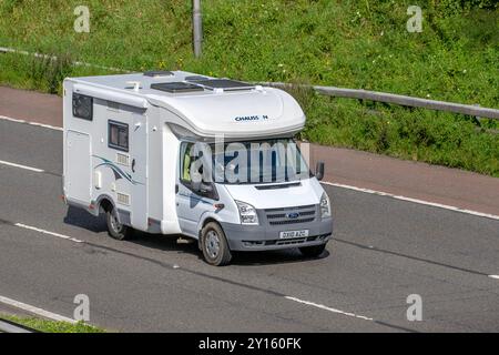 2010 White Ford Transit Chausson Flash 04 motorhome; travelling on the M6 motorway, UK Stock Photo