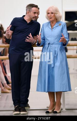 Aaron S. Watkin, Artistic Director and Queen Camilla, Patron of English National Ballet watch rehearsals at the English National Ballet's Mulryan Centre for Dance in east London. This is the Queen's first official visit to the English National Ballet since being made its patron earlier this year. Picture date: Thursday September 5, 2024. Stock Photo